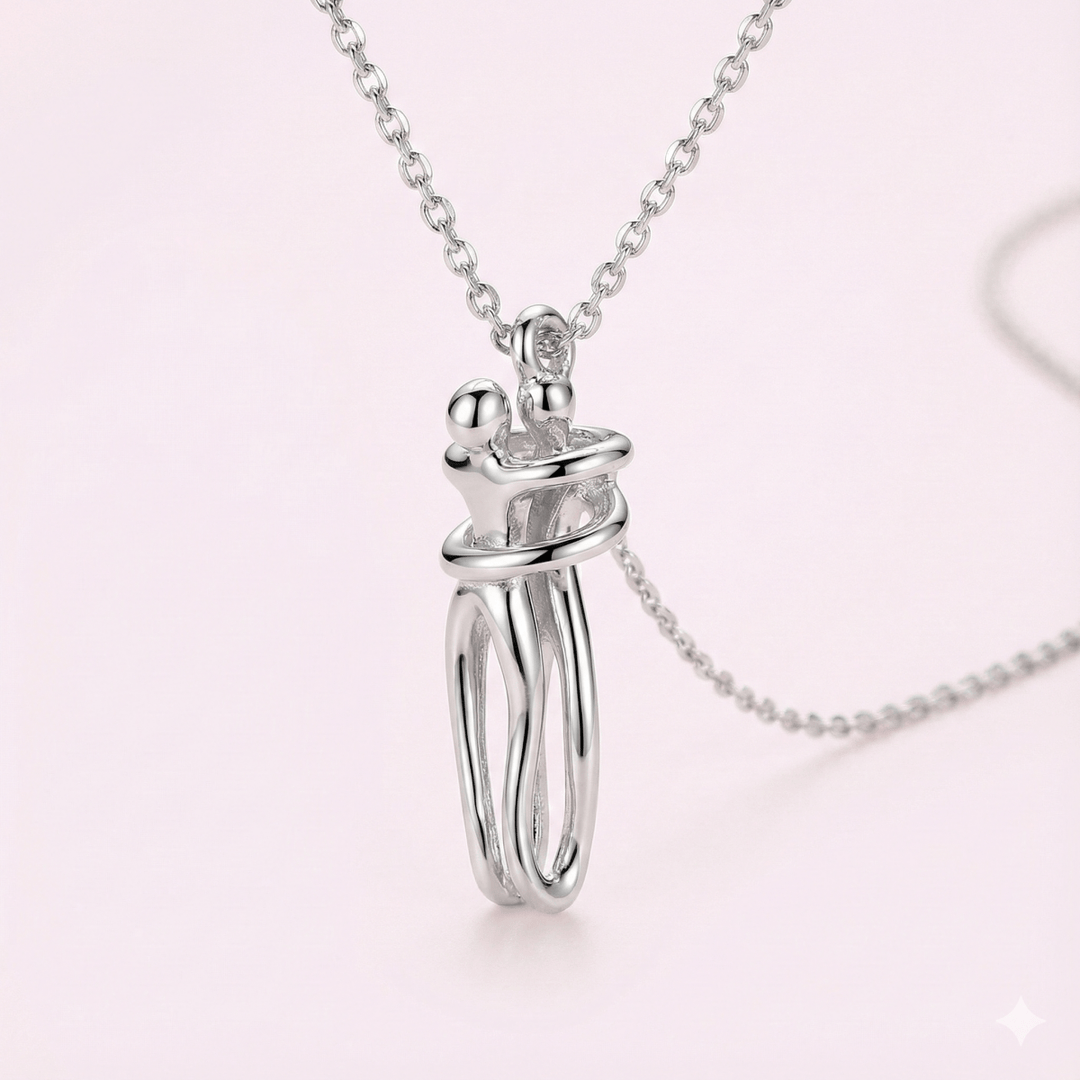 Abrazo eterno BlueBox - collar bicolor de plata 925 con colgante de pareja abrazada con caja de rosa azul giratoria - Podios