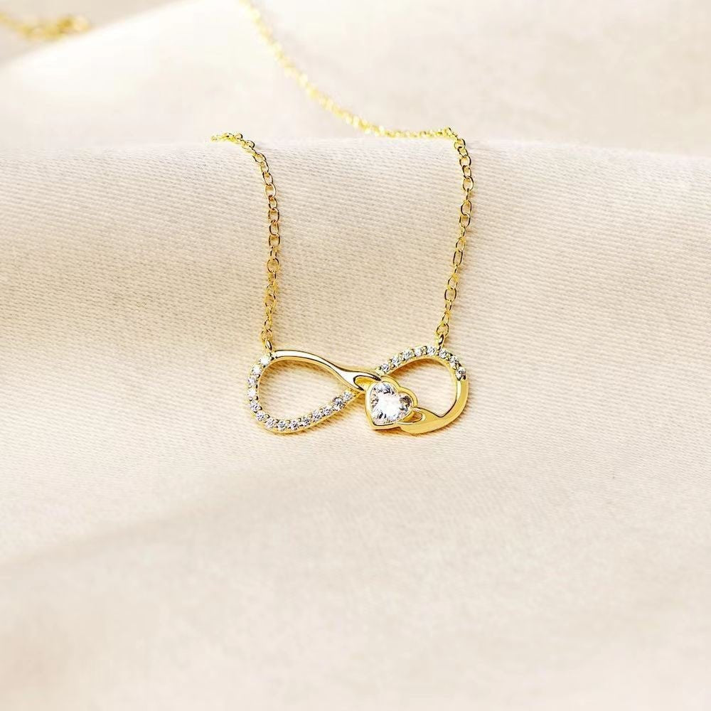 Collar Amour Eternel - Collar de Plata 925 enchapado en oro con diseño de infinito entrelazado con un abrazo y brillante de corazón - Podios