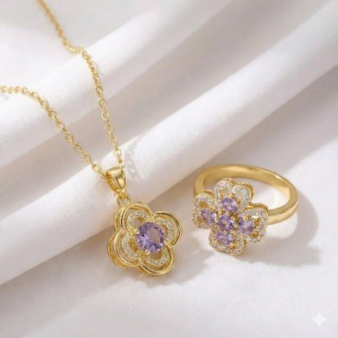 Lumiere Blossom Set - collar y anillo de trébol giratorio enchapado en oro 14k con cristal lila en caja de Rosa - Podios